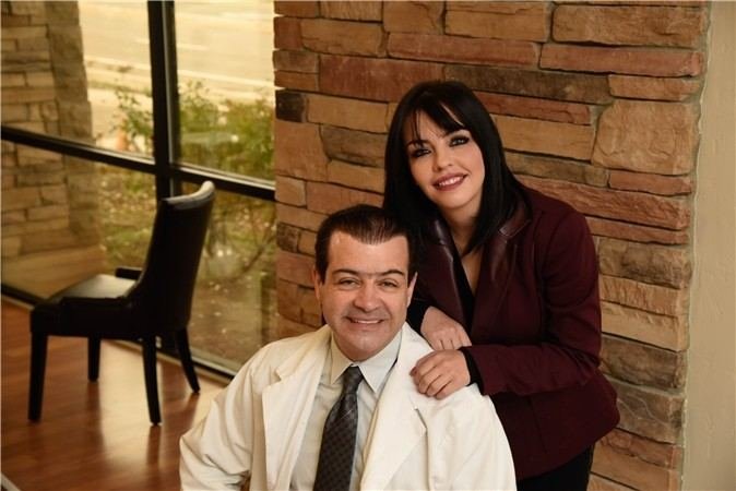 Dr. Farid Gogani in a white coat, seated, with a colleague standing behind him